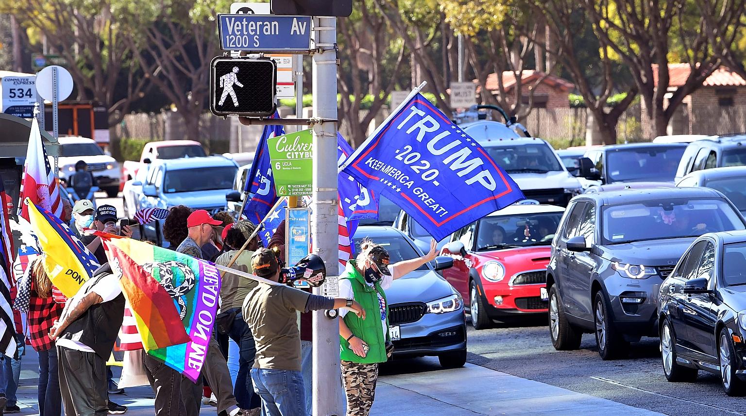 President Donald Trump's supporters in Los Angeles on Wednesday. Mr Trump's refusal to allow access to secure communications is creating risks in President-elect Joe Biden's dealings with foreign leaders.