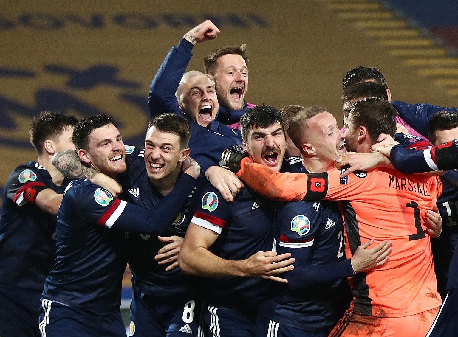 Joyous Scotland players after edging out Serbia 5-4 in the penalty shoot-out, after 1-1 in extra time, to qualify for next year's Euro 2020. They will be in Group D with England, Croatia and the Czech Republic.
