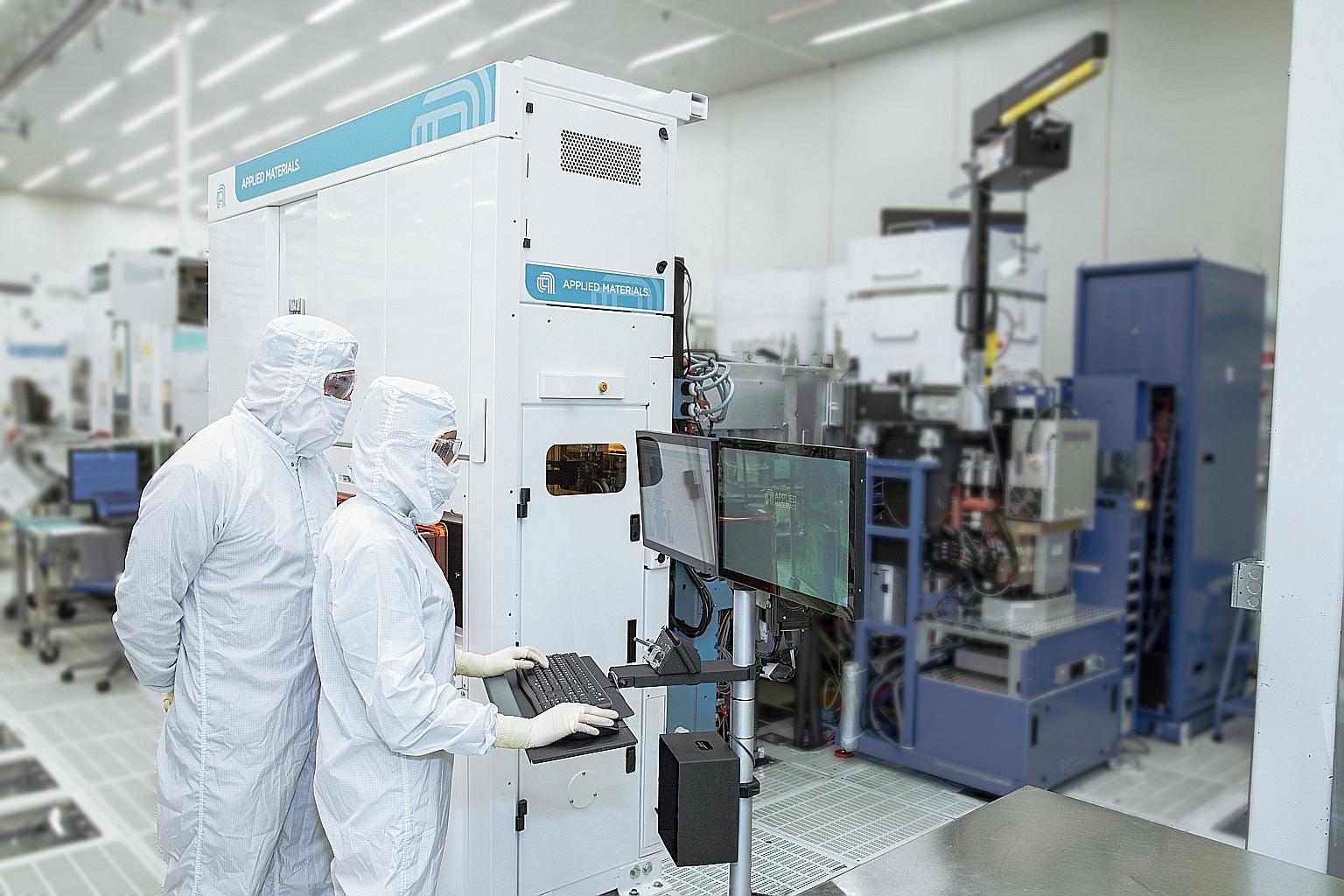 Engineers at work at Applied Materials, a firm supplying equipment and software for the manufacture of semiconductor chips. Not enough people are signing up to join the semiconductor industry despite the job opportunities available, said the Singapor