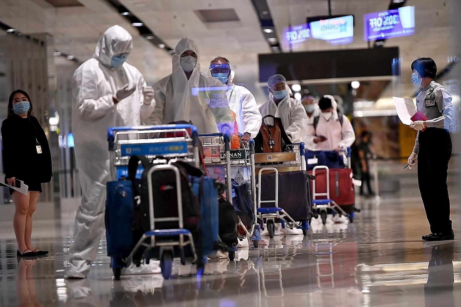 Seafarers arriving from Mumbai at Changi Airport Terminal One on June 12. The Maritime and Port Authority of Singapore said crew change has been facilitated for seafarers of all nationalities, from some 3,500 ships of different flags belonging to ove
