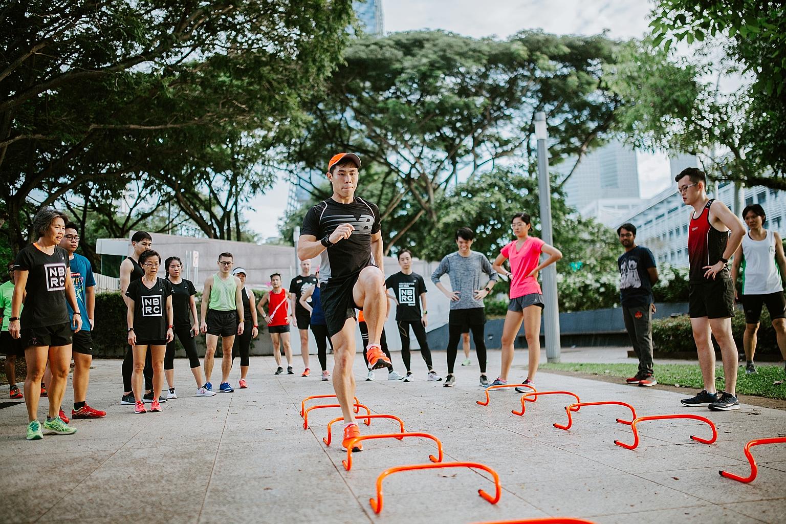 NBRC coach Loh Guo Pei showing some drills to club members. He splits sessions into three parts - warm-up, workout and cool-down.