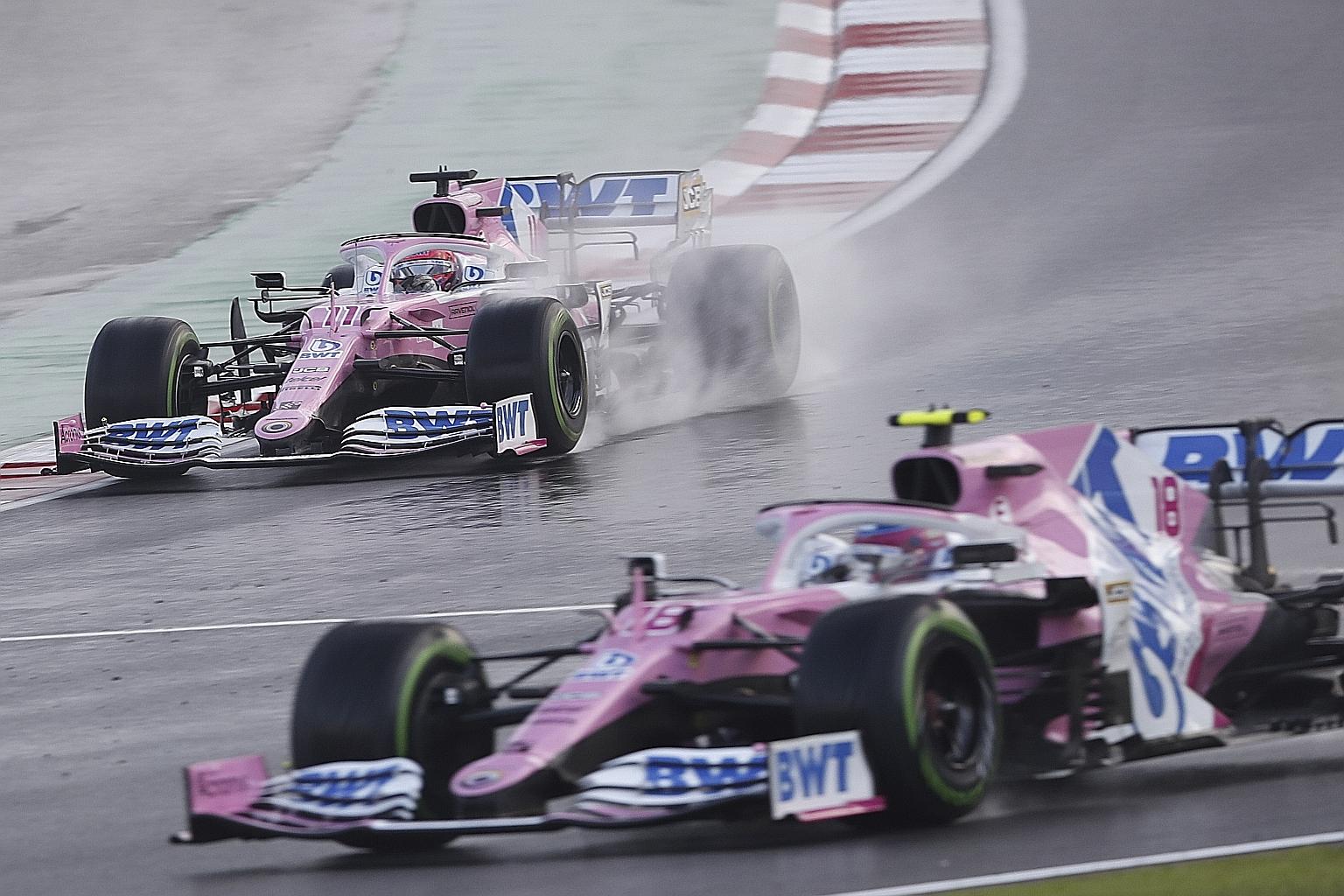 Lance Stroll (front) and Sergio Perez pushing their Racing Point cars to the limit on a wet track during yesterday's Turkish GP qualifying. They will start first and third respectively.