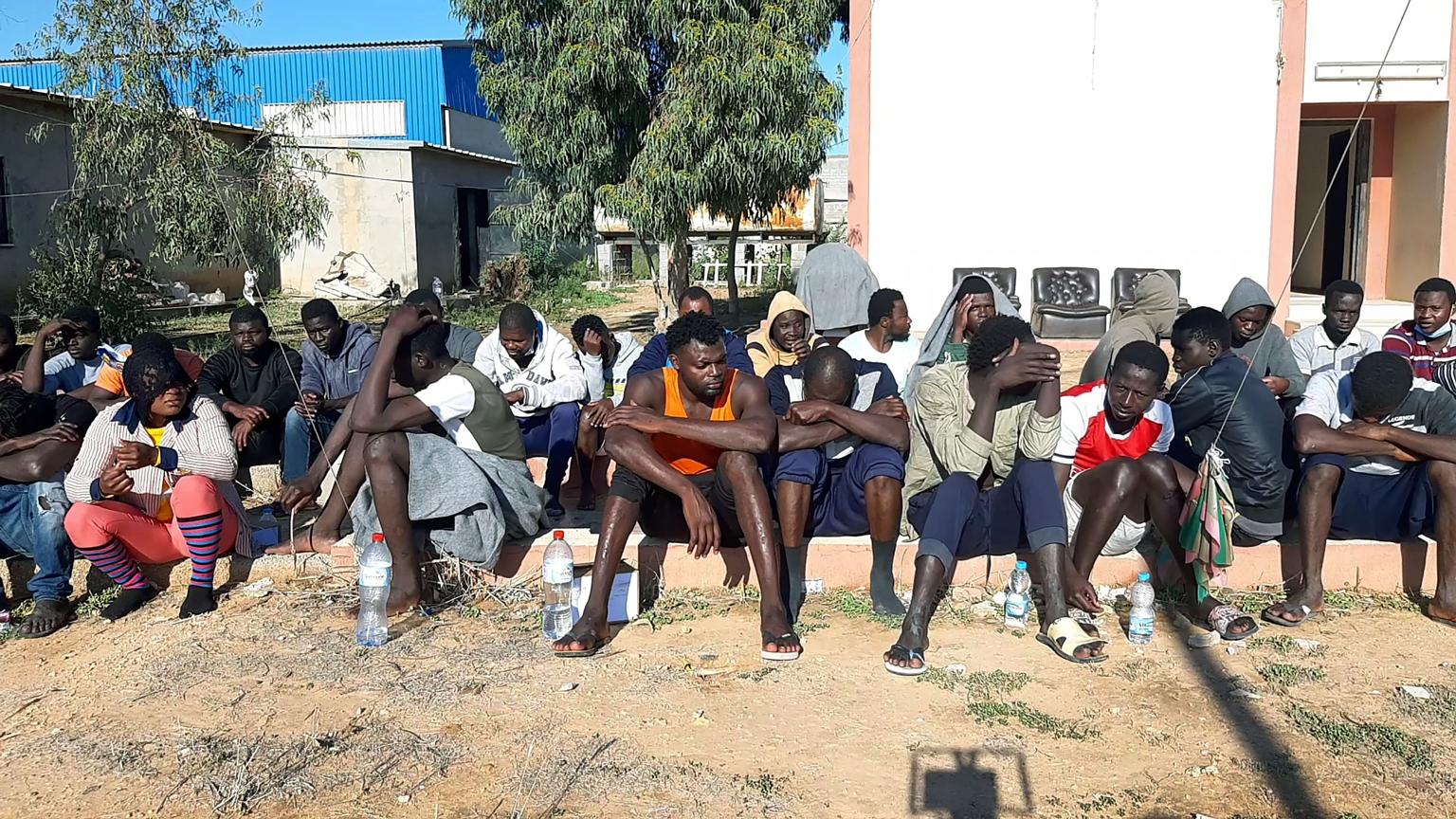 Migrants who survived a deadly shipwreck off the coast of Libya last Thursday waiting on the beach for assistance. The incident was one of two on the same day. PHOTO: AGENCE FRANCE-PRESSE