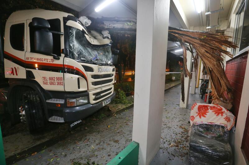 Lorry driver arrested after colliding into trees in front of HDB block ...