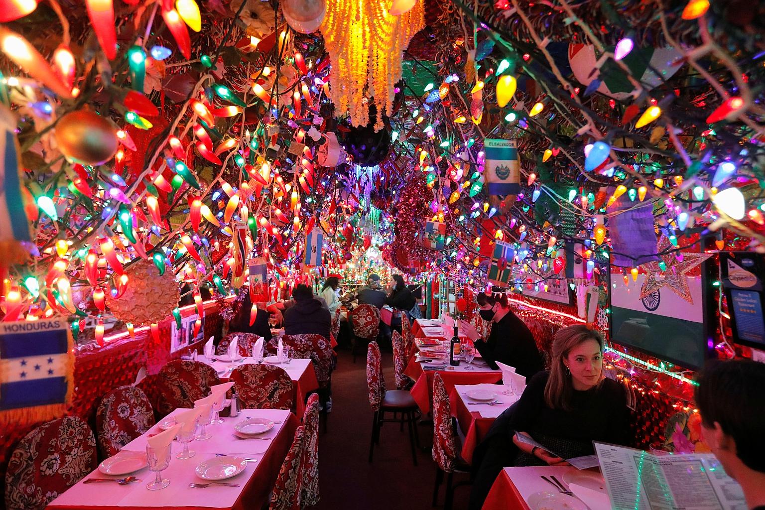 Diners at a restaurant in New York City last week. Basic public health measures such as wearing face masks have been politicised under Mr Donald Trump, who has eschewed mask mandates even after contracting Covid-19 last month, while President-elect J