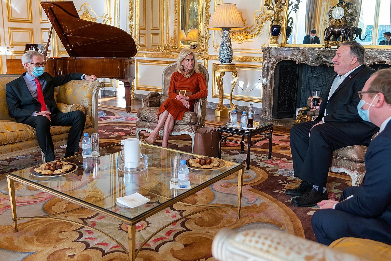 A handout photo from the US State Department showing Mr Mike Pompeo (second from right) and Ms Jamie McCourt, US ambassador to France, at the Institut Montaigne in Paris last Saturday. PHOTO: EPA-EFE
