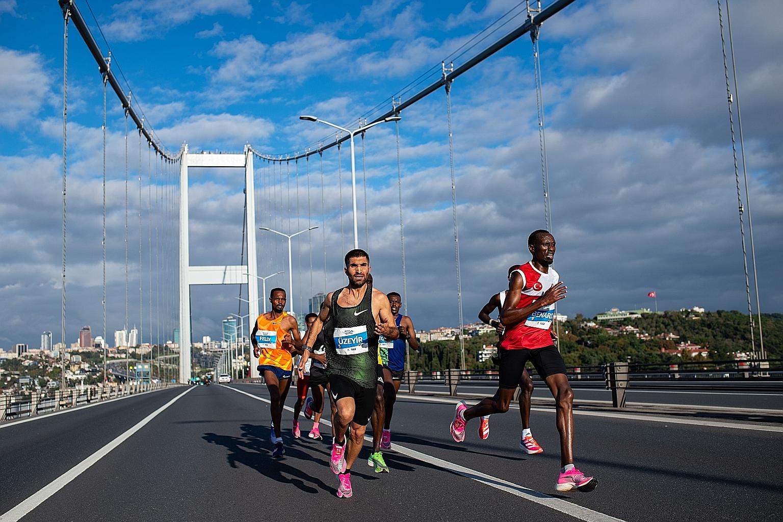 Participants crossing the Bosphorus Bridge in the annual Istanbul Marathon earlier this month. Sports psychologists and elite endurance athletes advise people to create small milestones en route to a big goal in their quest to build mental fortitude.