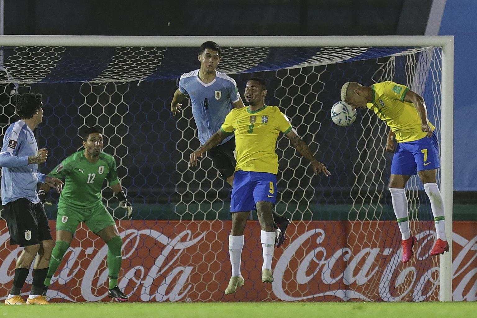 Richarlison heading in the second goal in Brazil's 2-0 win over Uruguay at the Centenario Stadium in Montevideo on Tuesday. The Selecao lead Argentina by two points after four World Cup qualifiers.