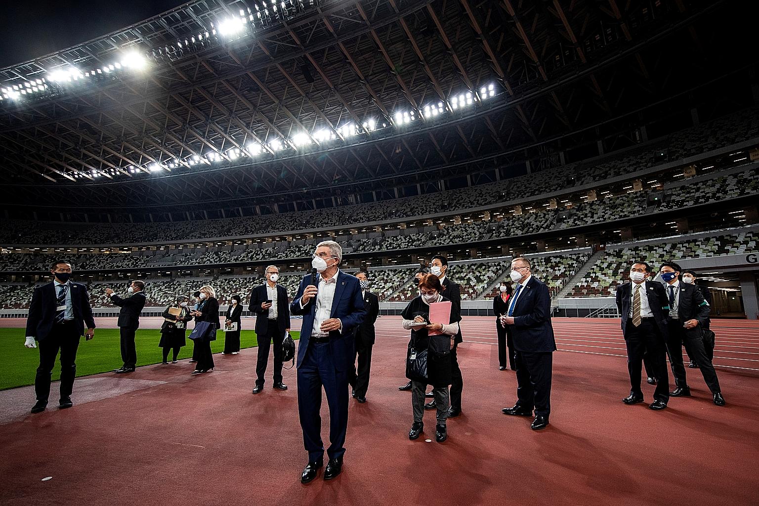 IOC president Thomas Bach addressing the media during a visit to the National Stadium in Tokyo ahead of the postponed Olympics.