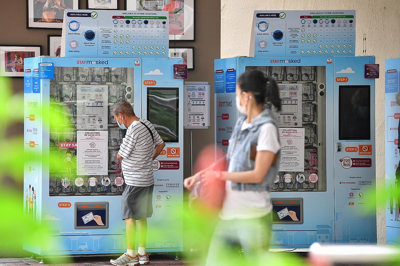 Mask vending machines at Jalan Besar Community Club, with notices informing people the collection will start on Nov 30. This will be the third nationwide mask distribution by Temasek Foundation. The masks in this exercise are from local company Prosh