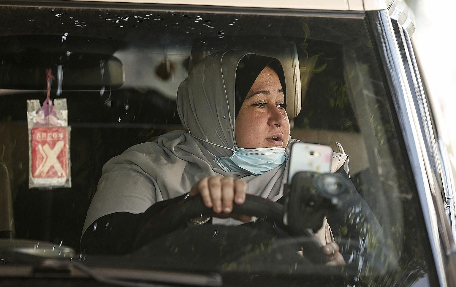 Ms Naela Abu Jibba, who has a degree in community service, started her taxi business after failing to find work. She gets a lot of sexist jibes about her driving abilities, but encouraging comments are far greater in number.