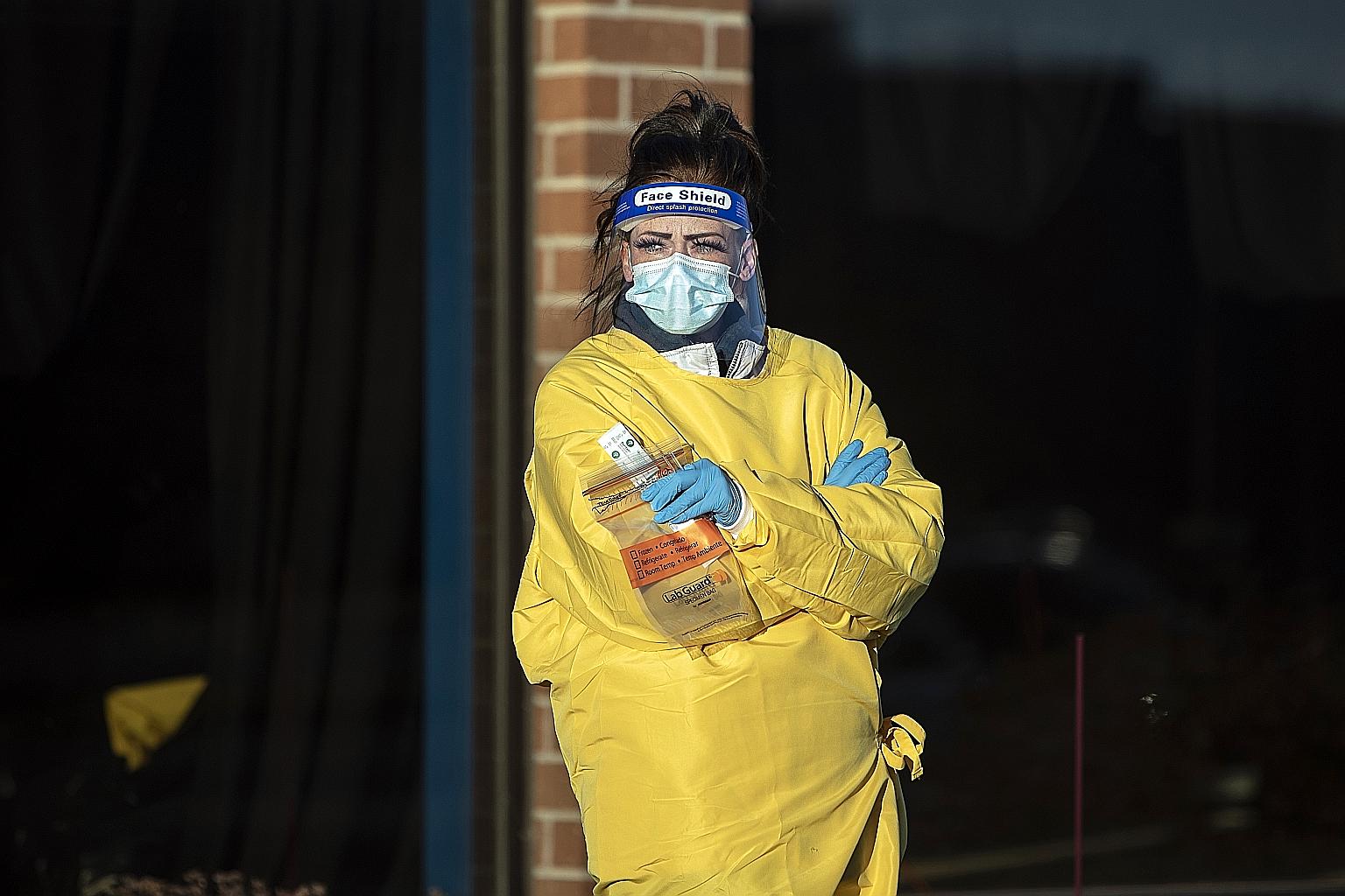 A healthcare worker at a Covid-19 testing site in West Des Moines, Iowa. Coronavirus cases in the United States' long-term care facilities have risen alongside the pandemic's surge in the general population. More than half of its nursing homes have e