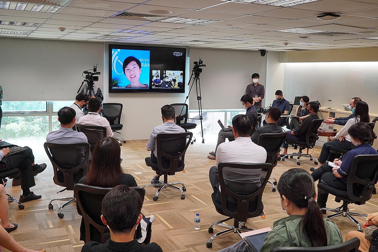 Manpower Minister and Second Minister for Home Affairs Josephine Teo talking to course participants about social issues and the country's approach to the pandemic over Skype on Oct 8.