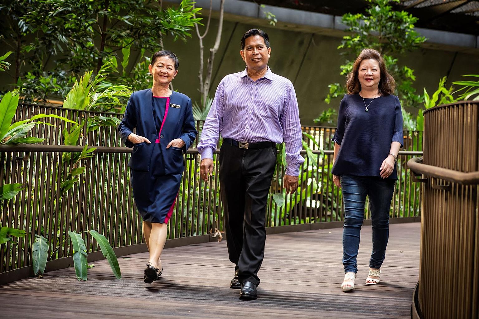Prudential Singapore's long-time employees include (from left) Ms Sue Li, 64, Mr Abdullah Rahim and Ms Mary Goh, both 62. They have been working for Prudential Singapore for between 25 and 42 years and are keen to keep going.