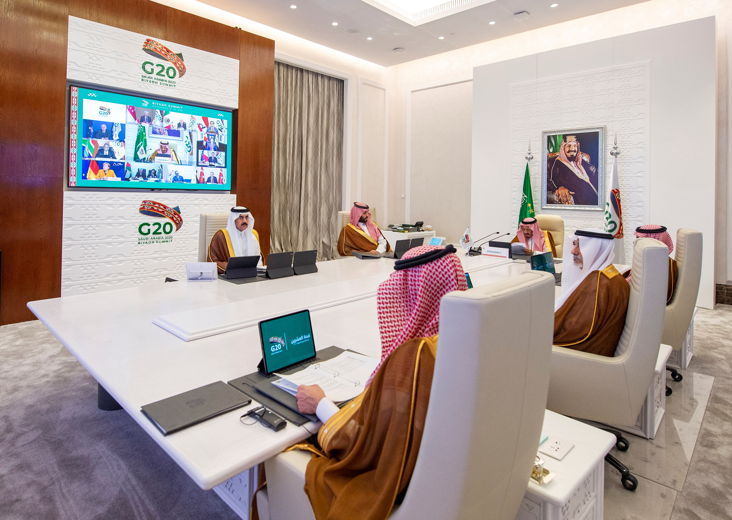 Saudi Arabia's King Salman bin Abdulaziz Al Saud (head of table) giving a speech during an opening session of the virtual Group of 20 summit in Riyadh yesterday. World leaders are huddling virtually in the two-day meeting as international efforts int