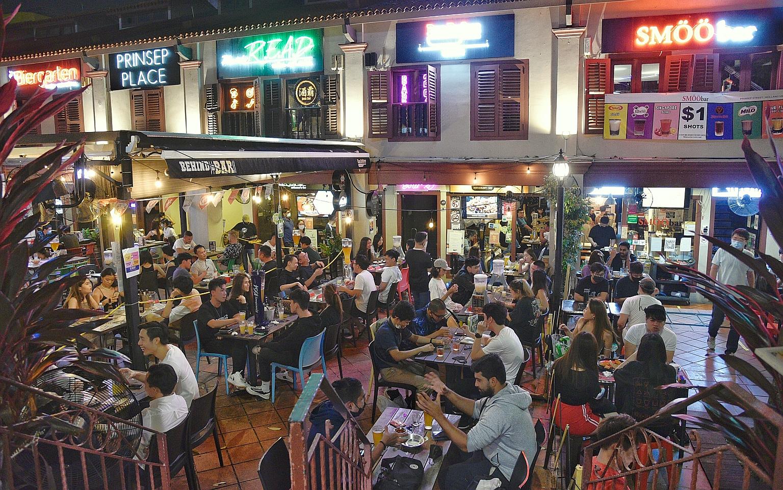 People dining at Prinsep Place last Friday night while practising safe distancing measures. Since Nov 1, there have been fewer locally transmitted cases, with two from the community and five from the dorms on Nov 3, 4, 5 and 10. Most cases have been
