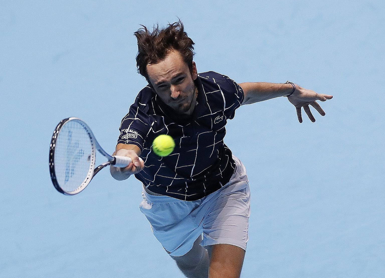 Russia's Daniil Medvedev returning to Austrian Dominic Thiem en route to his 4-6, 7-6 (7-2), 6-4 win for a maiden ATP Finals title. It was the last Finals to be held in London ahead of the season-ender's move to Turin next year.