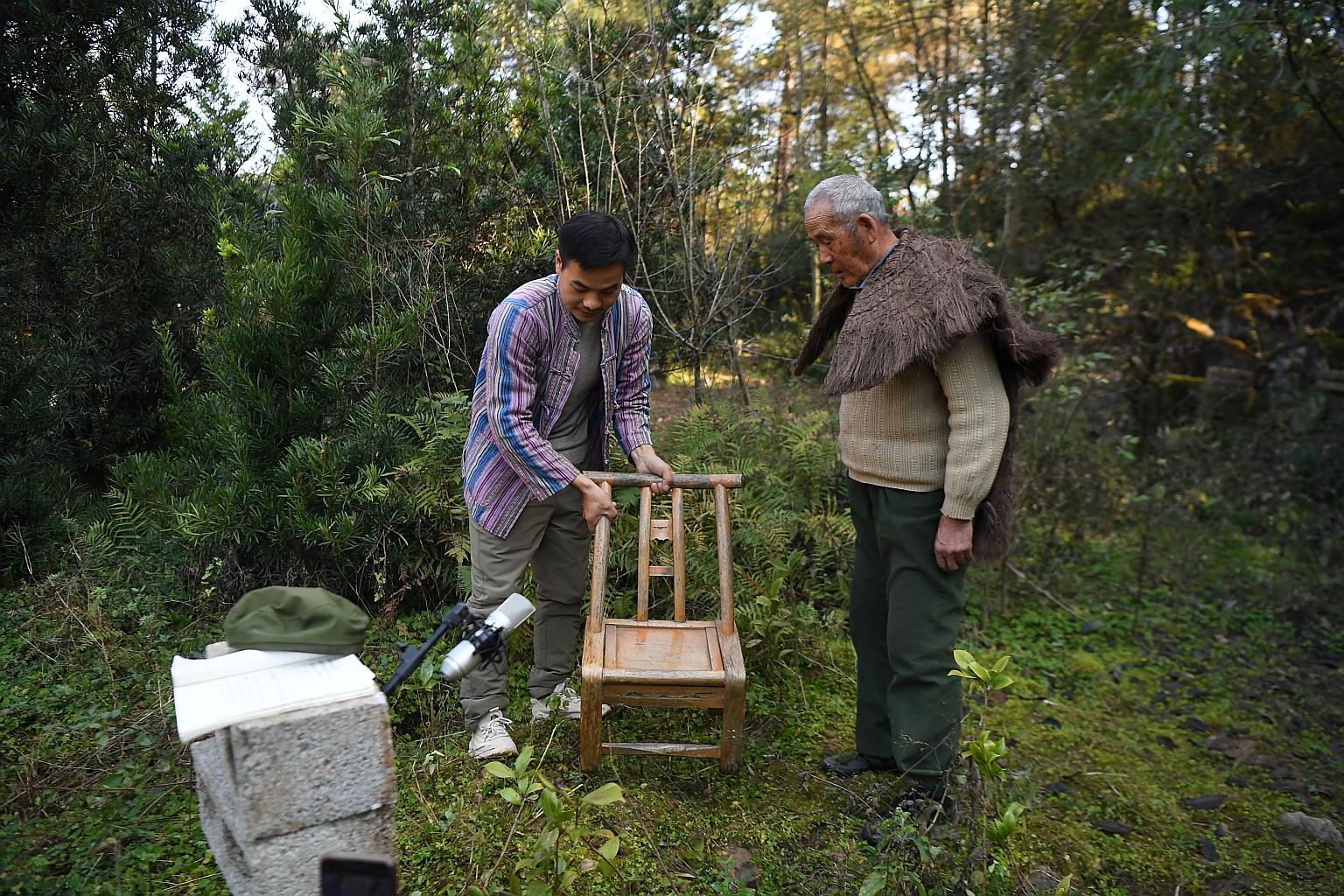 Villager Peng Guofei, 75, preparing for a video shoot. He has 161,000 followers on Douyin - the Chinese version of TikTok - where he discusses social issues, touts local specialities and introduces attractions.