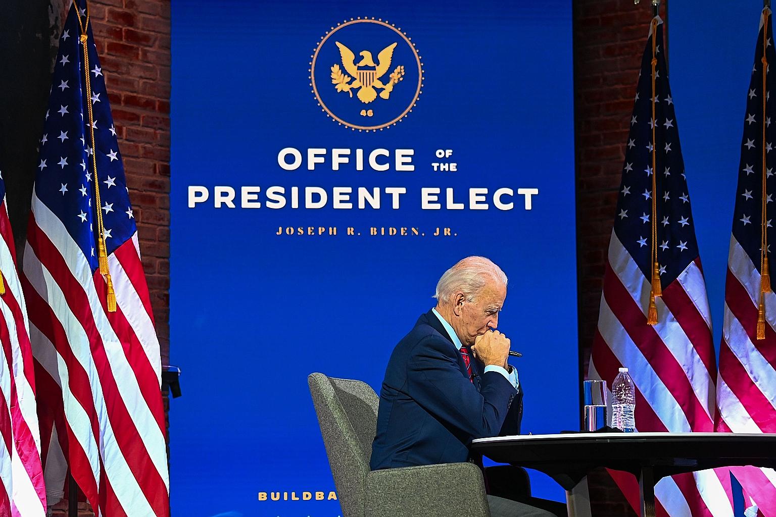 President-elect Joe Biden taking part in a virtual conference in Wilmington, Delaware, on Monday. Mr Biden won 306 state-by-state electoral votes, well over the 270 needed for victory, and also holds a lead of more than six million in the national po