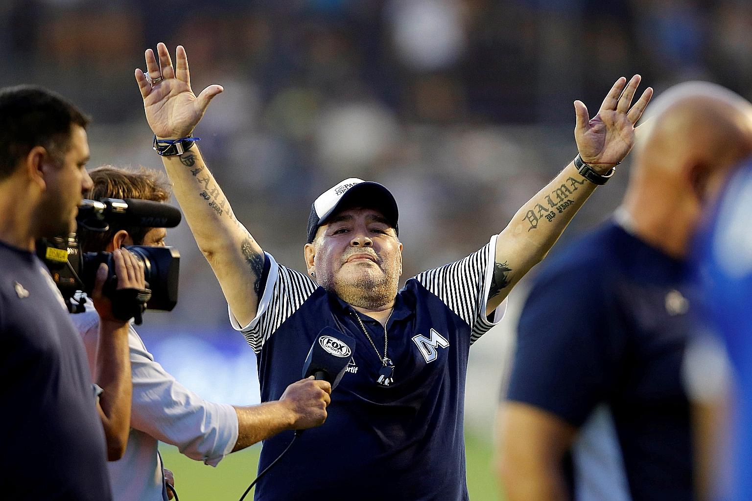 Above: Diego Maradona at a game in La Plata, Argentina, in February. He suffered a heart attack in Buenos Aires after undergoing surgery to remove a blood clot from his brain earlier this month. Left: Maradona and his team celebrating Argentina's Wor