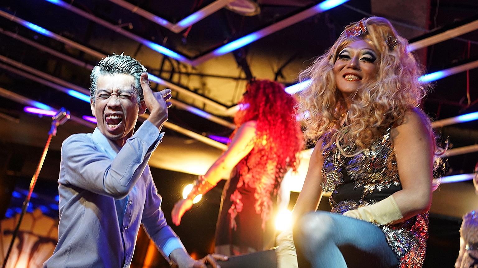 Azni Samdin (above left) on the set of Number 1 with cast member Jaspers Lai (right).