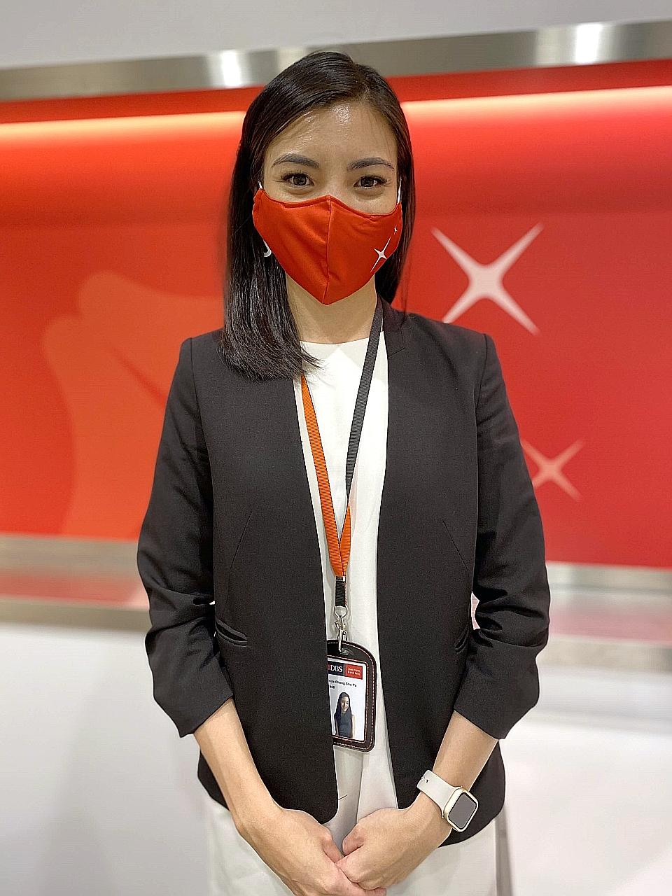 Former flight stewardess Brinda Cheng, a wealth planning manager at DBS' Bishan branch, is among over 2,000 people the bank hired this year.