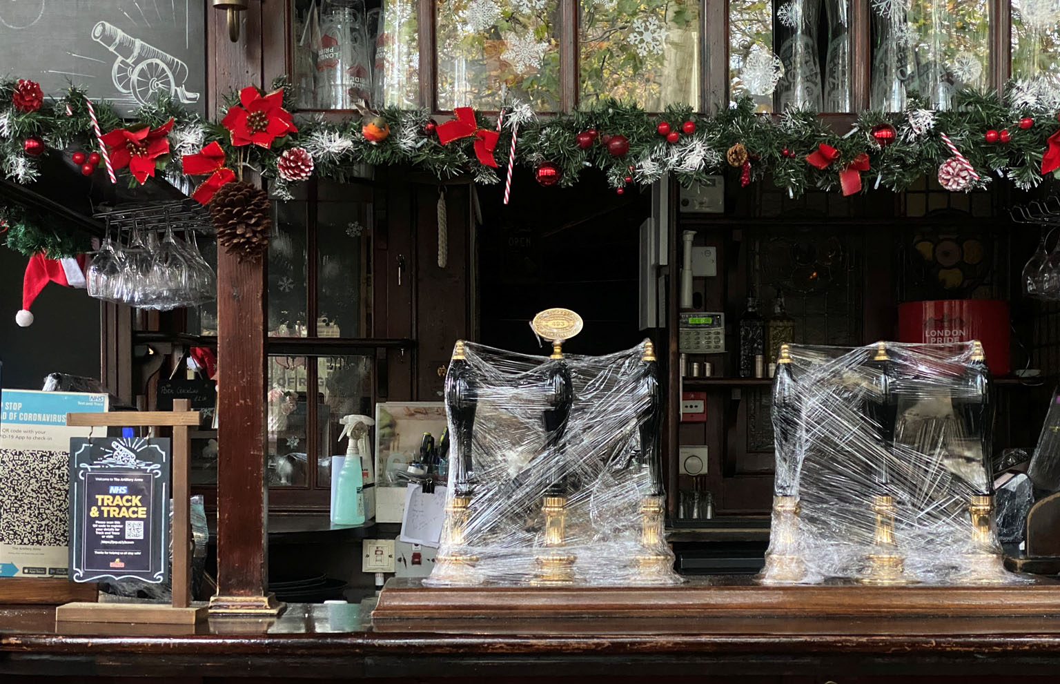 A pub in London remains shut for business, with beer pumps covered in clingfilm. The city's Mayor Sadiq Khan has lobbied for London to be in tier two, warning that a tier three alert rating would be "catastrophic" for the capital's hospitality indust