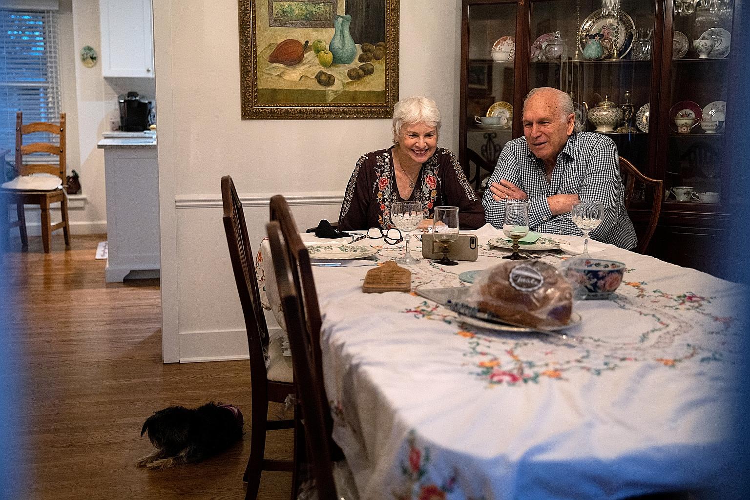 The Segals - Janis and Uri - in Detroit, Michigan, connecting with their family via Zoom for Thanksgiving this year. The annual holiday is being celebrated at a time of severe economic strain for millions of Americans.