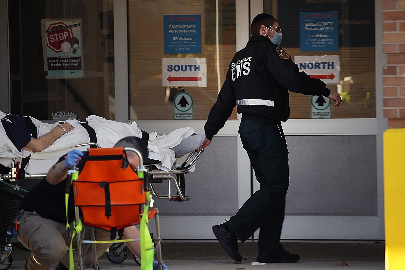 A patient being wheeled into Maimonides Medical Centre in Brooklyn, a borough of New York City, on Nov 23.