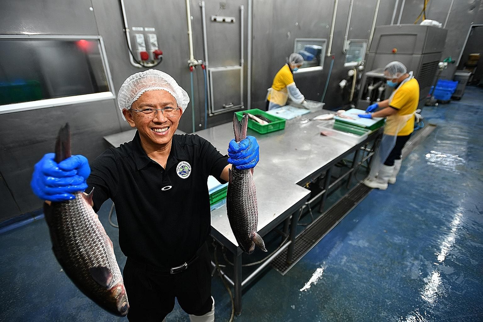 Staff making assam mullet chowder at The Soup Spoon's production kitchen. Fishery company The Fish Farmer sends the mullet it farms to Hai Sia Seafood, which scales the fish and processes it into fillets. Instead of the offcuts being discarded, they 
