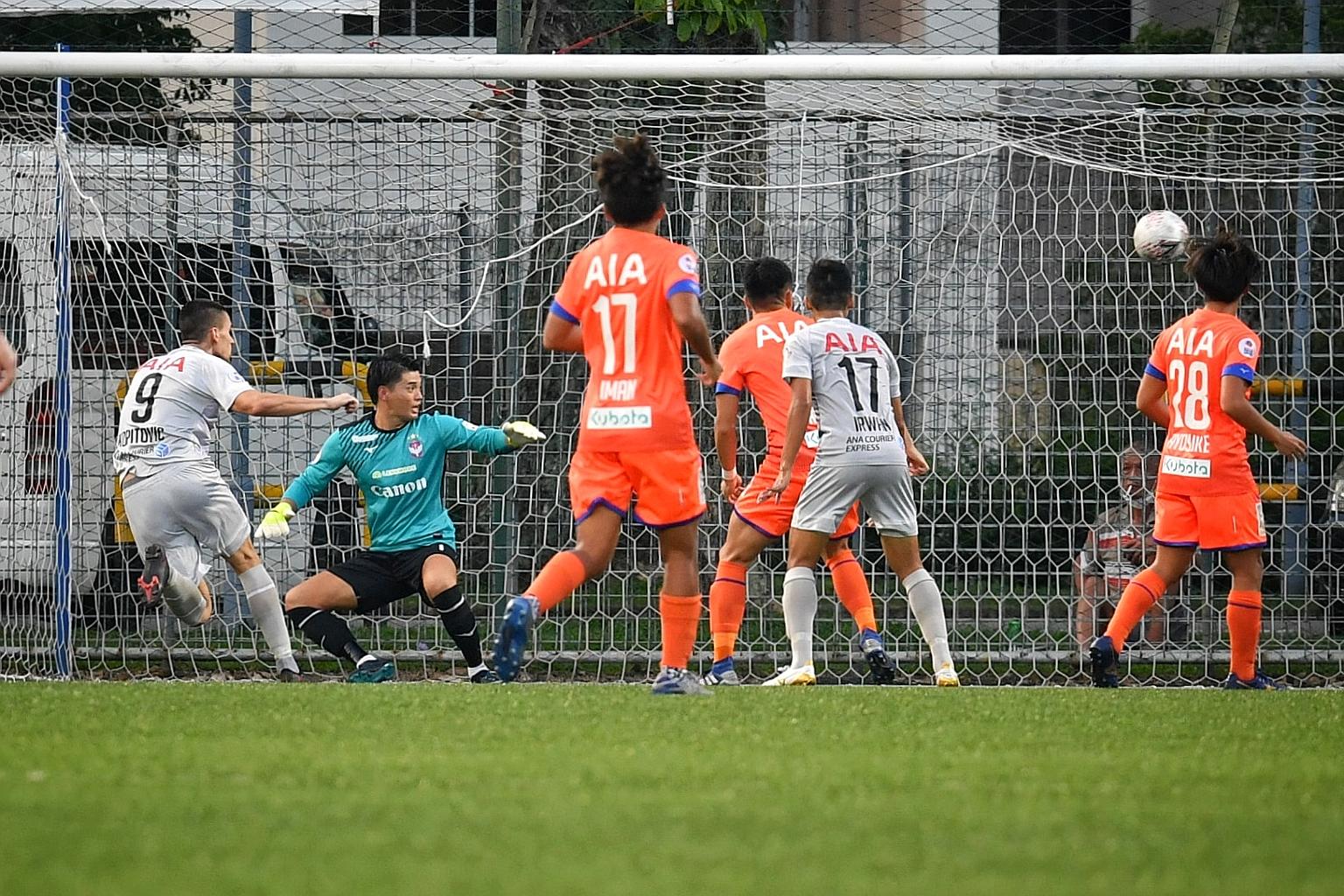 Boris Kopitovic (No. 9) scoring Tampines Rovers' equaliser against Albirex Niigata, setting his side up for a stirring comeback in a 4-1 victory at the Jurong East Stadium. ST PHOTO: CHONG JUN LIANG