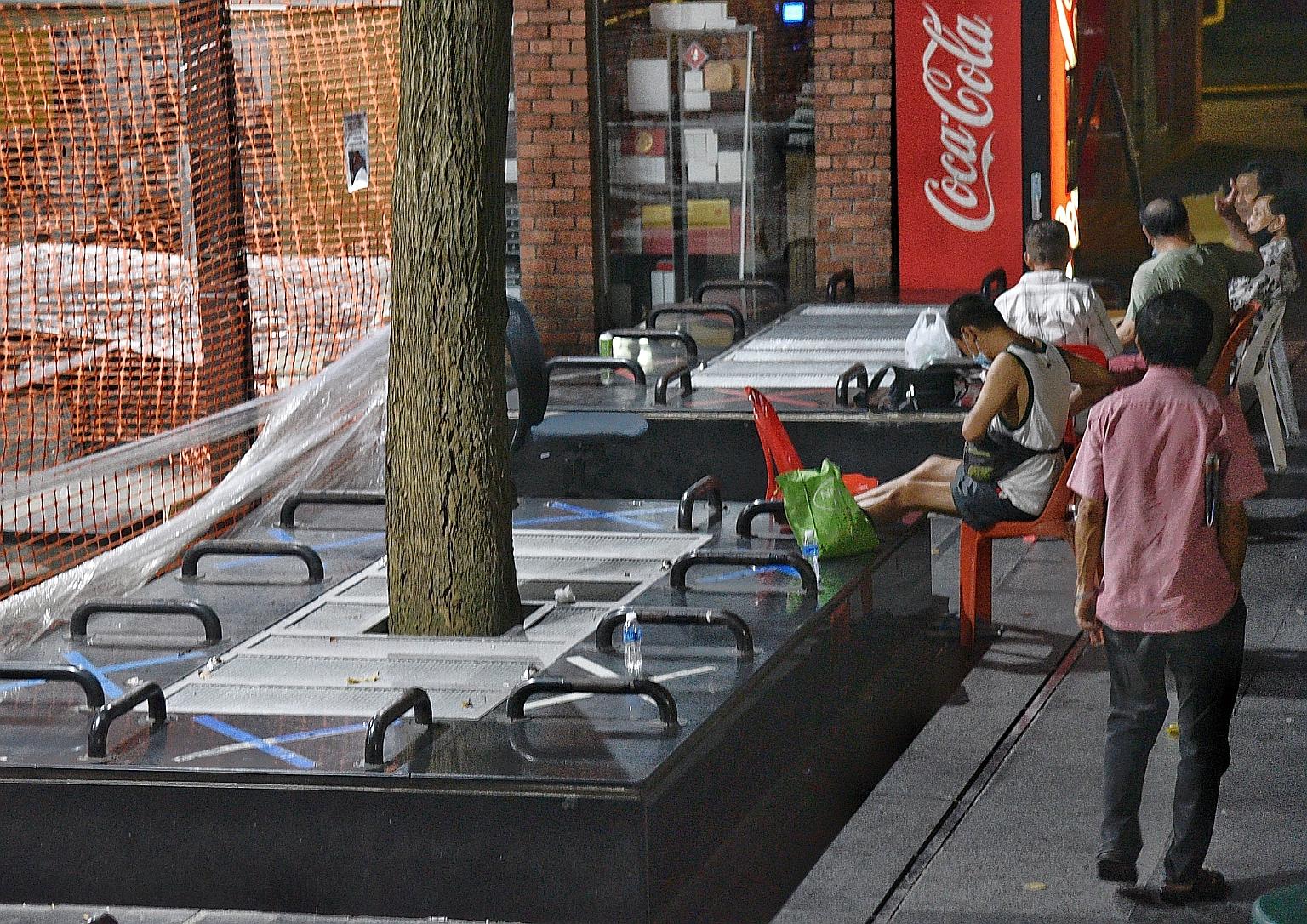 Public benches with dividers at Kreta Ayer Square. Observers point to the growing prevalence of such designs, saying they are prime examples of urban features that are "defensive" or "hostile" towards the homeless. ST PHOTO: DESMOND WEE