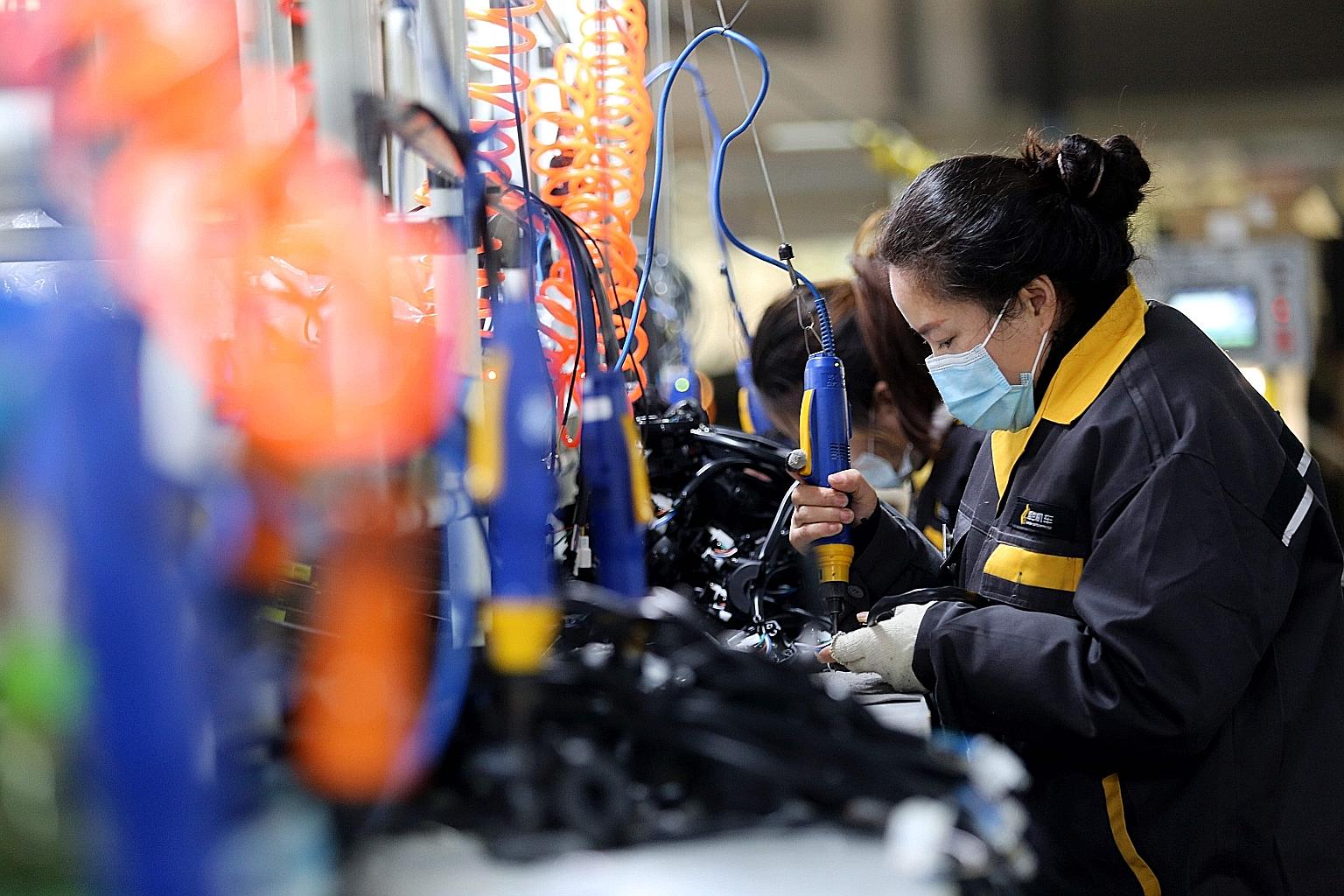 China's Purchasing Managers' Index rose to 52.1 last month from 51.4 in October as its industrial sector recovers.
