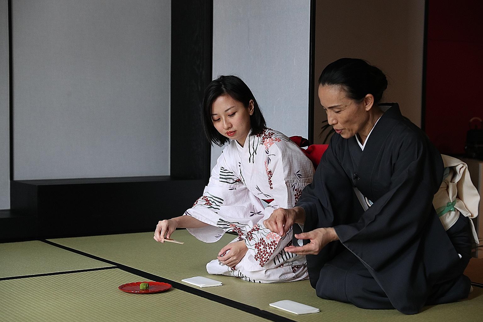 The writer (far left) learns proper Japanese tea ceremony etiquette from Ms Yasuko Norris (left), a tea ceremony teacher and kimono dresser. (Clockwise from above) Keyaki at Pan Pacific Singapore is situated within a quaint Japanese garden; a katsu d