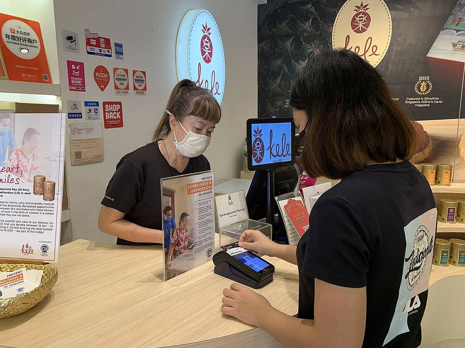 Lions Befrienders has partnered GivePls to set up over 30 contactless donation terminals, located at outlets such as Kele. PHOTO: LIONS BEFRIENDERS