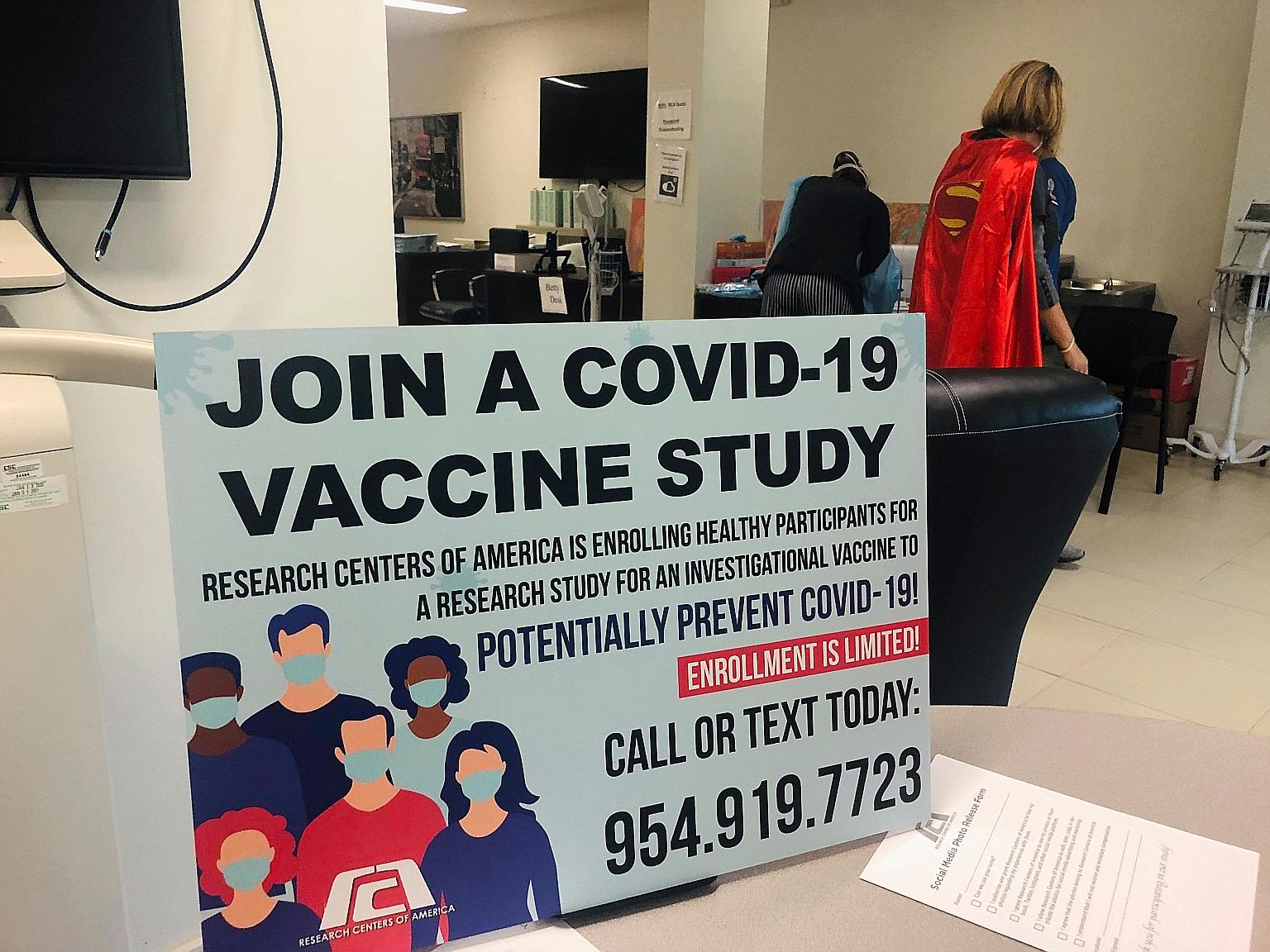 A sign calling for vaccine study participants at the Research Centres of America in Florida, during the phase three trial of Moderna's Covid-19 vaccine in August. PHOTO: AGENCE FRANCE-PRESSE
