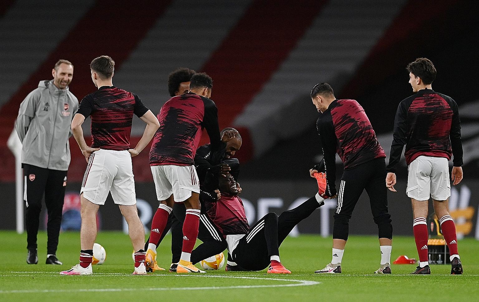 Arsenal manager Mikel Arteta says Thomas Partey (on ground) is back in training and in contention for today's derby against Tottenham.