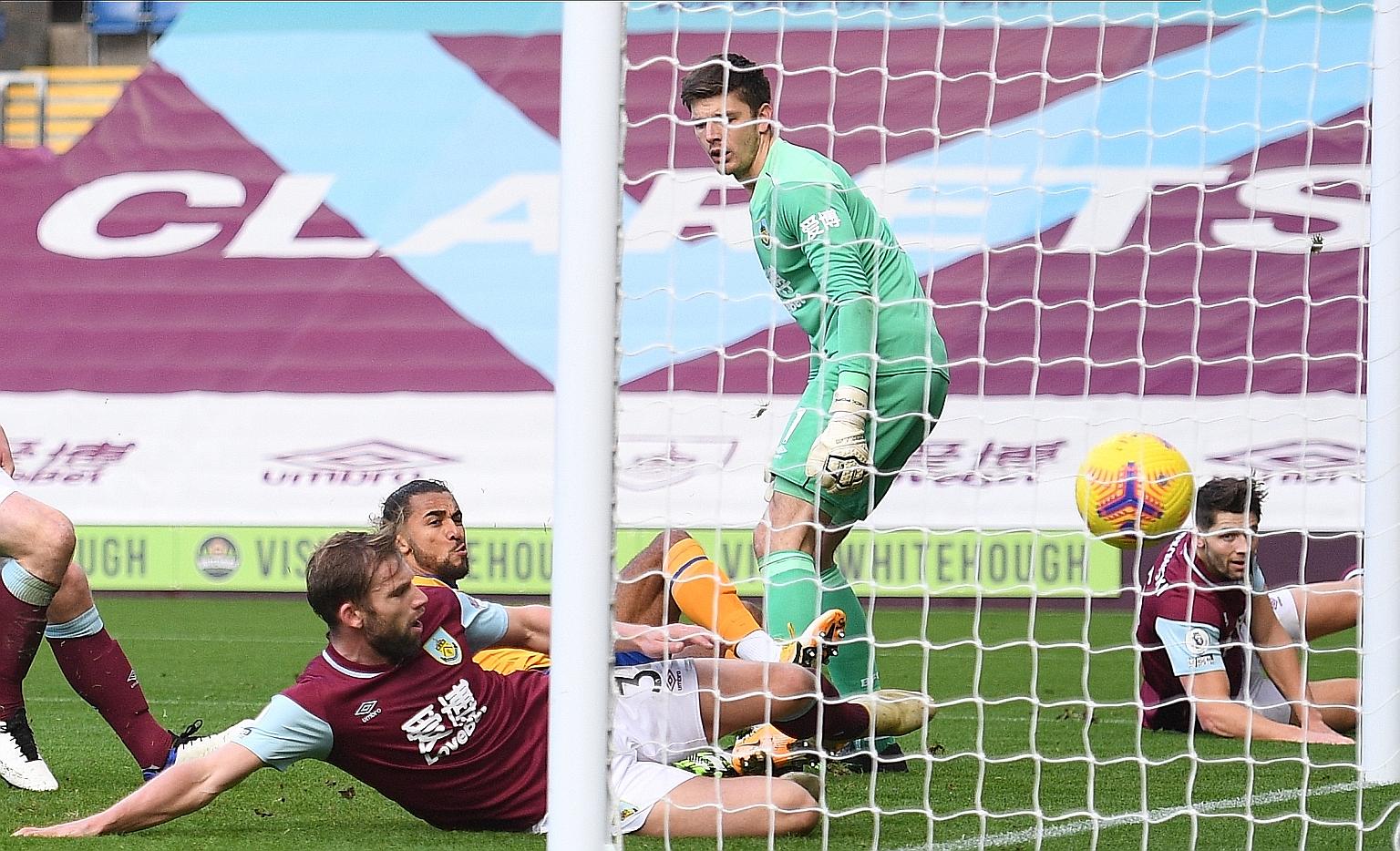 Everton striker Dominic Calvert-Lewin scoring past Burnley goalkeeper Nick Pope during their Premier League match yesterday. The England international has more league goals from inside the box (11) than any other player in Europe's top five divisions