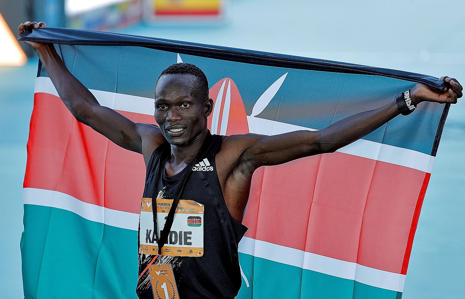 Kenya's Kibiwott Kandie celebrating after winning the Valencia Half Marathon in a world-record 57min 32sec.