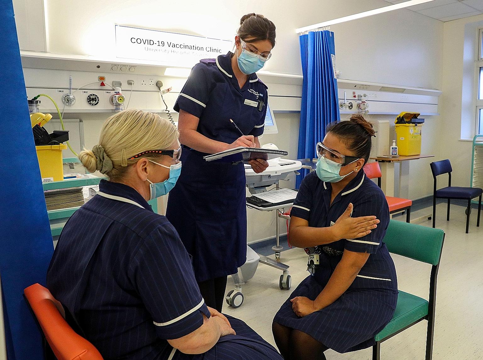 Matron May Parsons (right) being assessed during training in the Covid-19 Vaccination Clinic at the University Hospital in Coventry, central England last Friday, as the National Health Service geared up to begin administering jabs to the most vulnera