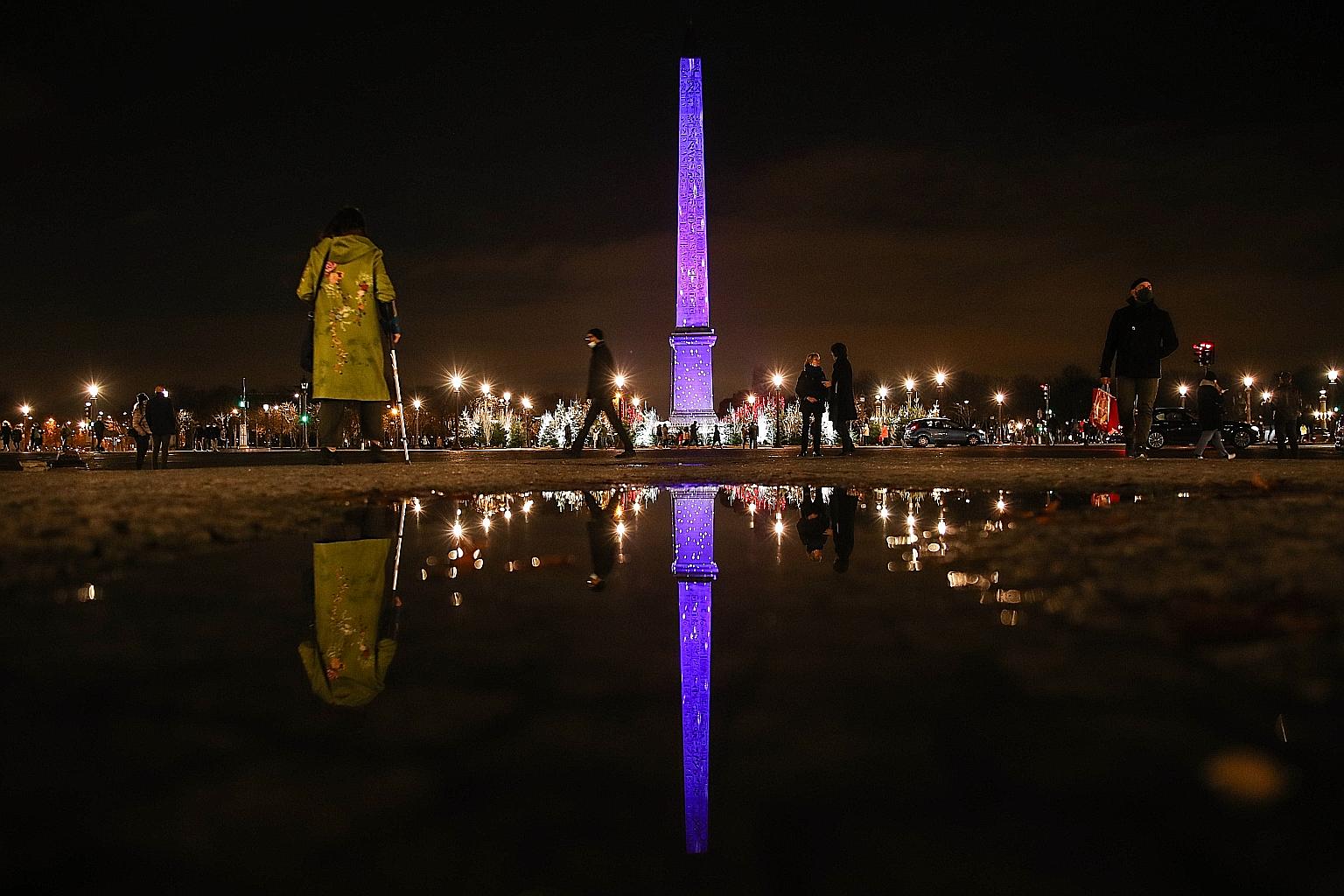 The Luxor Obelisk at Place de la Concorde in Paris all lit up in blue as part of the French capital's annual Christmas illuminations. The launch event on Nov 22 saw the turning on of a million crimson and blue lights on trees lining the famous Champs