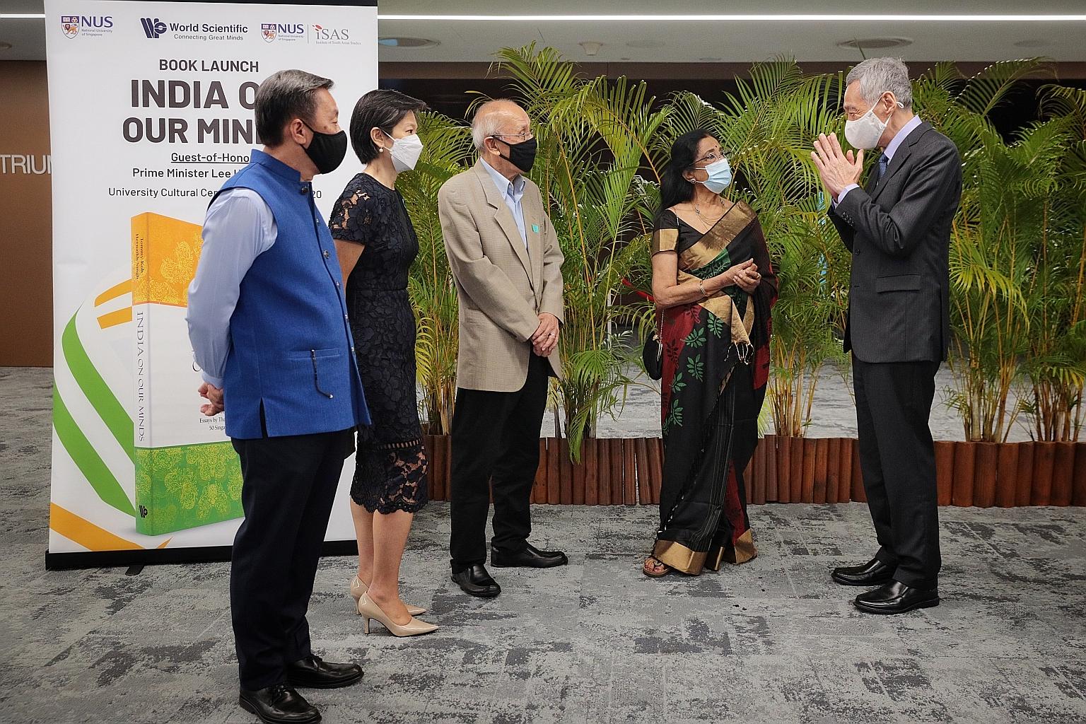 Above: The book India On Our Minds was launched yesterday. Left: Prime Minister Lee Hsien Loong speaking with its contributing authors (from far left) Yale-NUS College president Tan Tai Yong; MCI senior adviser, international affairs and former high 
