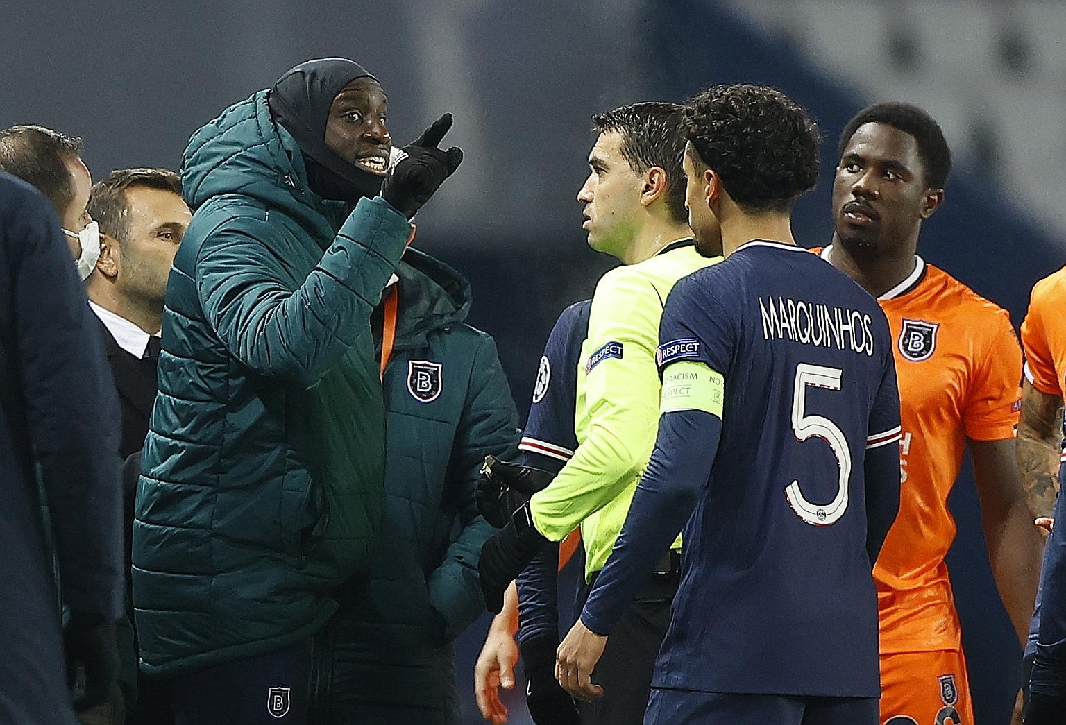 Basaksehir substitute Demba Ba remonstrating with referee Ovidiu Hategan after assistant coach Pierre Webo was allegedly abused by the fourth official in the Champions League game against PSG on Tuesday.