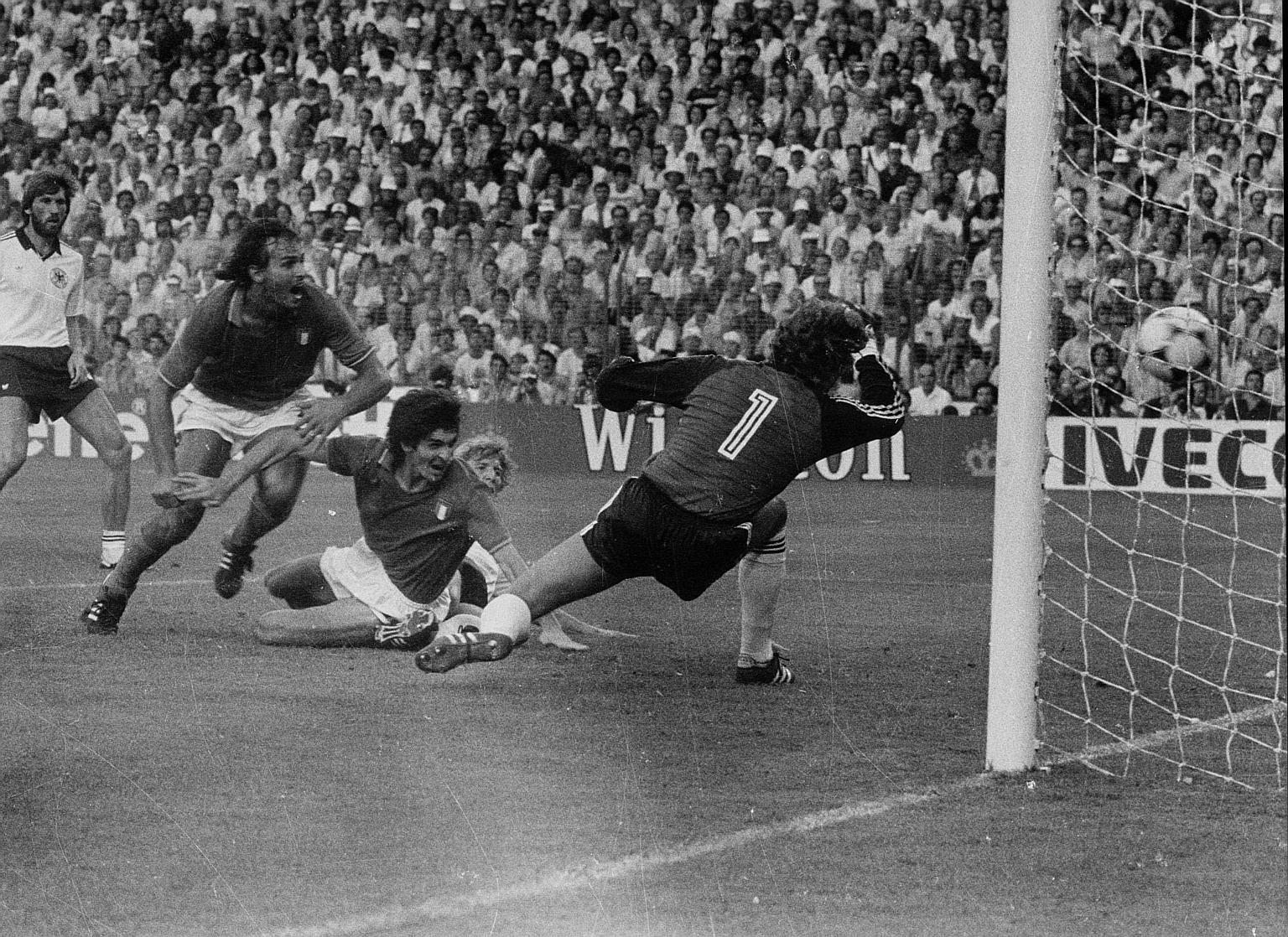 Italian Football Federation president Gabriele Gravina describes Paolo Rossi (left) as one who was "indelibly linked to the blue shirt and his style of play inspired many strikers of future generations". Below: Rossi scoring the opening goal for Ital