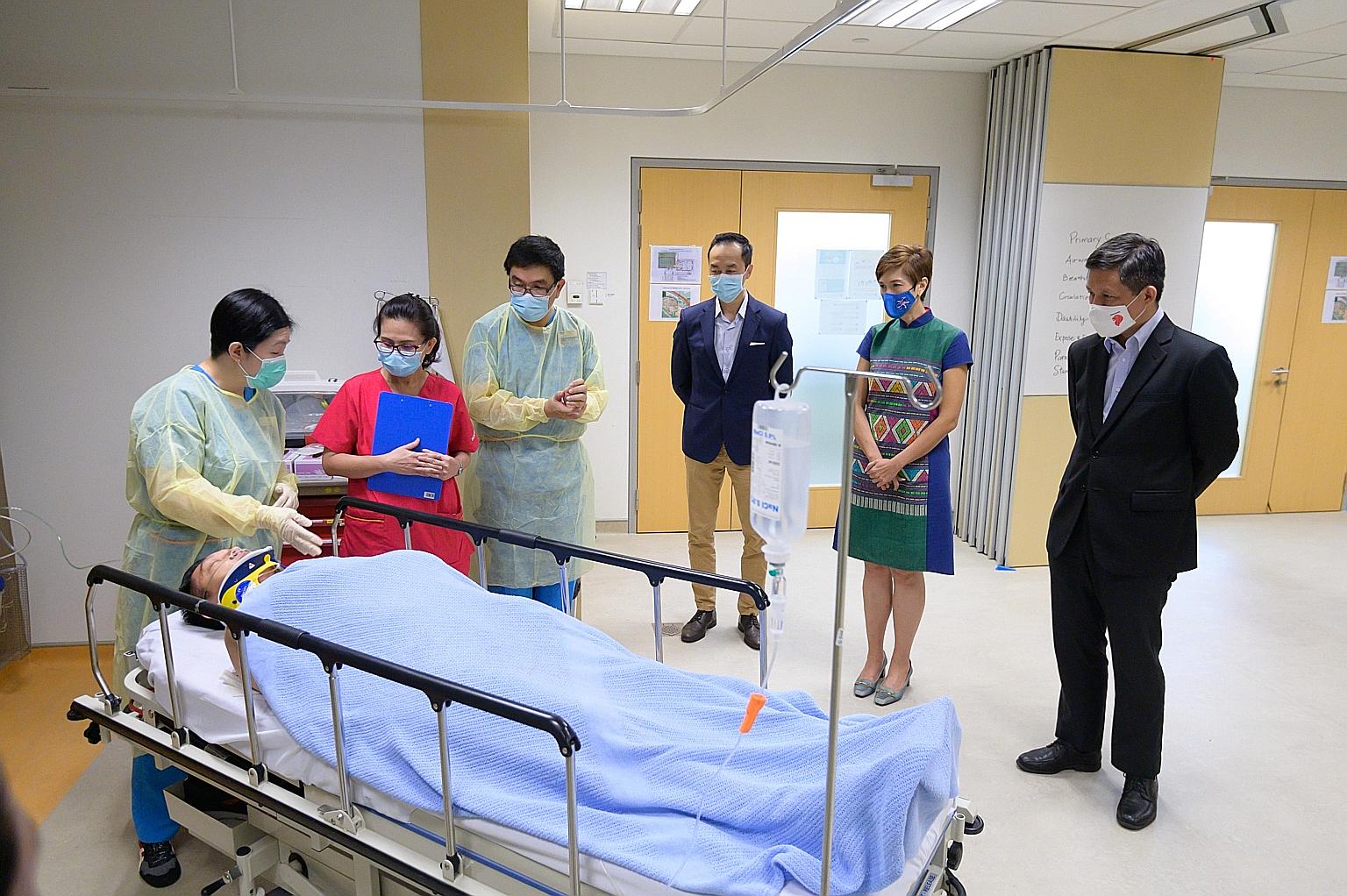 (From right) Trade and Industry Minister Chan Chun Sing, Manpower Minister Josephine Teo and Senior Minister of State for Health Koh Poh Koon observing a class undergoing training at the National University of Singapore's Alice Lee Centre for Nursing