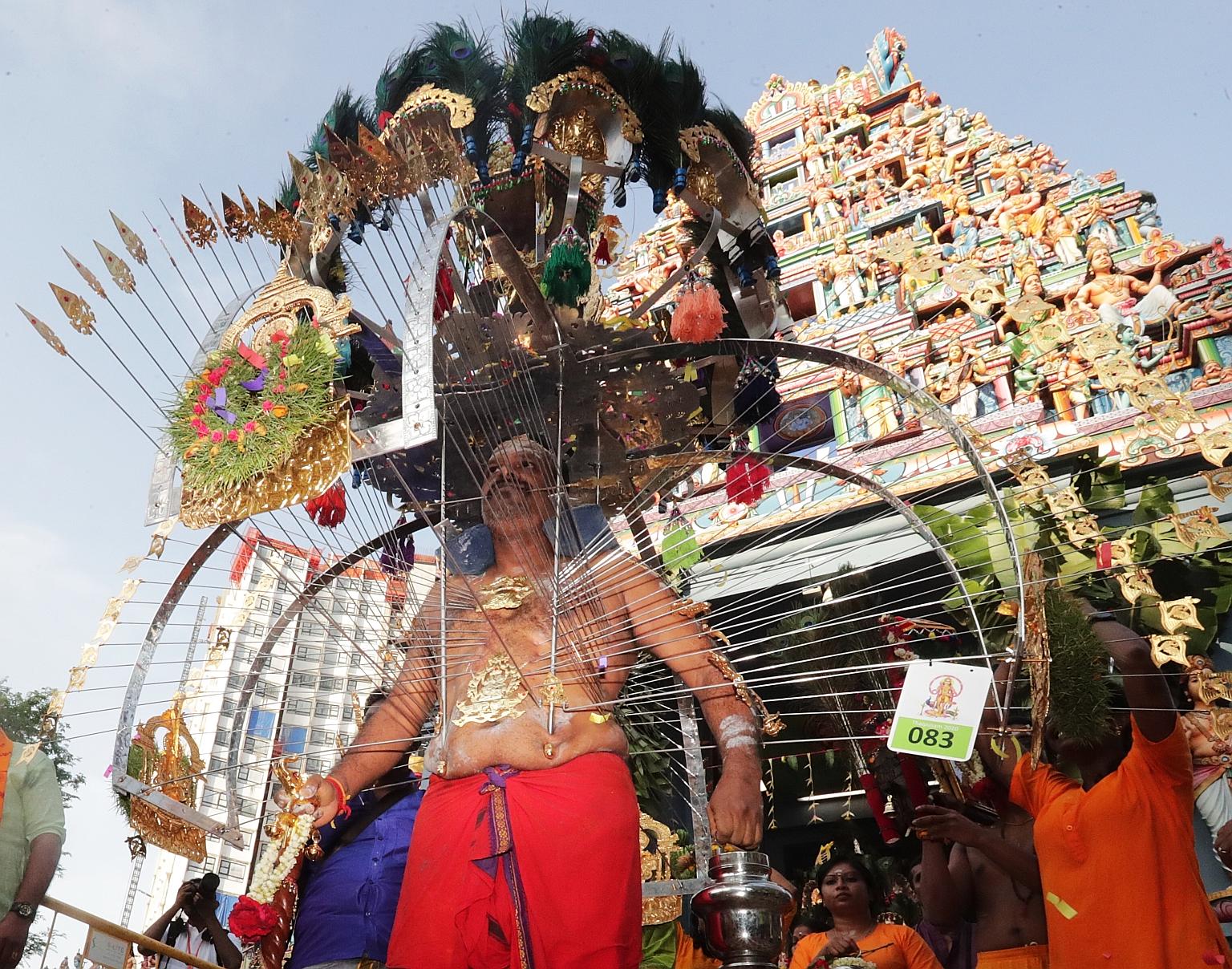 A kavadi bearer at the Thaipusam procession in February at the Sri Srinivasa Perumal Temple in Serangoon Road. To prevent potential outbreaks of Covid-19, all forms of kavadis will be banned for the upcoming festival. ST FILE PHOTO