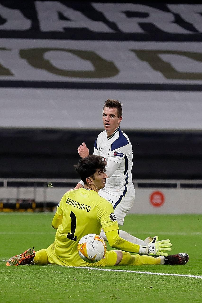 Midfielder Giovani lo Celso beating Antwerp goalkeeper Alireza Beiranvand to score Tottenham's second goal during their Europa League match on Thursday. Spurs won 2-0 to top Group J.