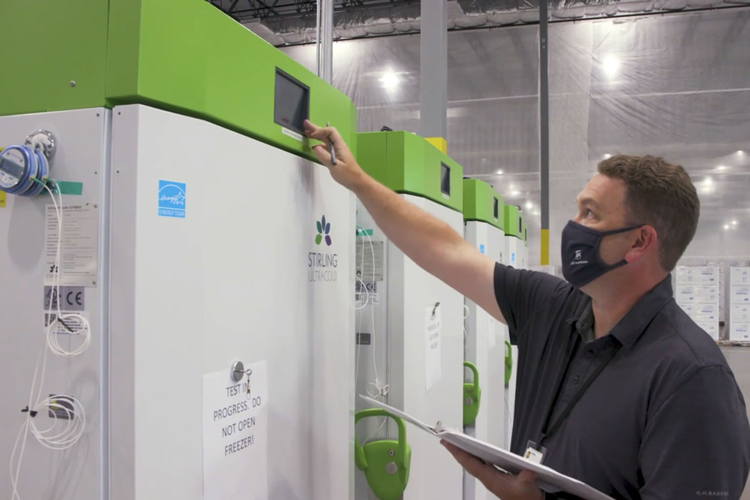 A screenshot from a video by United Parcel Service showing freezer units being unpacked and tested in anticipation of the FDA's approval of the emergency use request for Pfizer's Covid-19 vaccine. The delivery giant and FedEx are on stand-by to ship