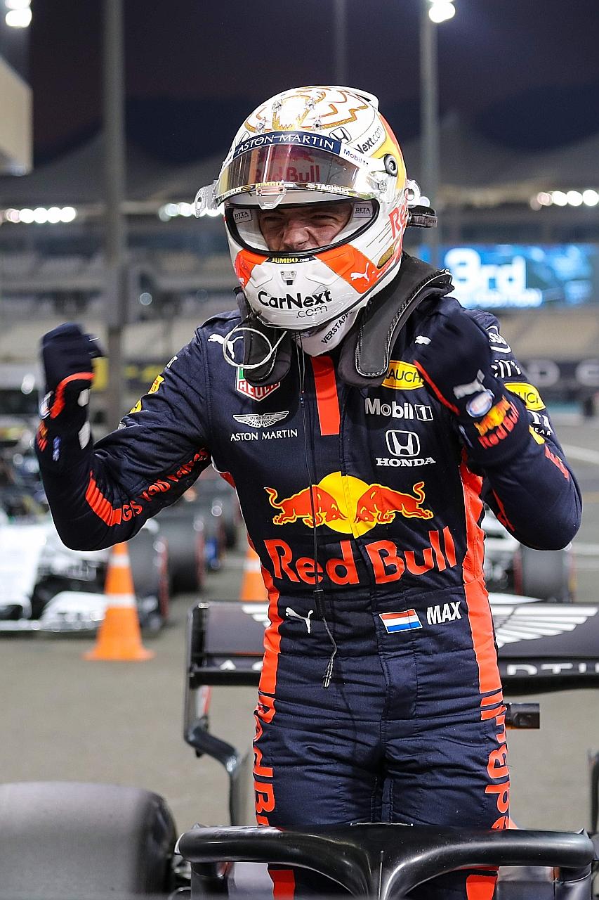 Red Bull's Dutch driver Max Verstappen celebrating after securing his third career pole by qualifying top for the Abu Dhabi F1 race at the Yas Marina Circuit.