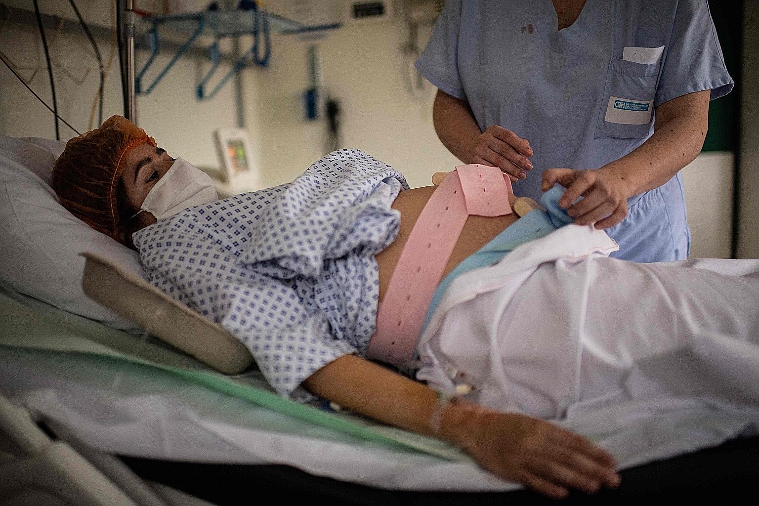 A nurse helping a pregnant woman at the Diaconesses hospital in Paris last month. In the US, the American College of Obstetrics and Gynecology, the Society for Maternal and Fetal Medicine and other groups have urged the Food and Drug Administration t